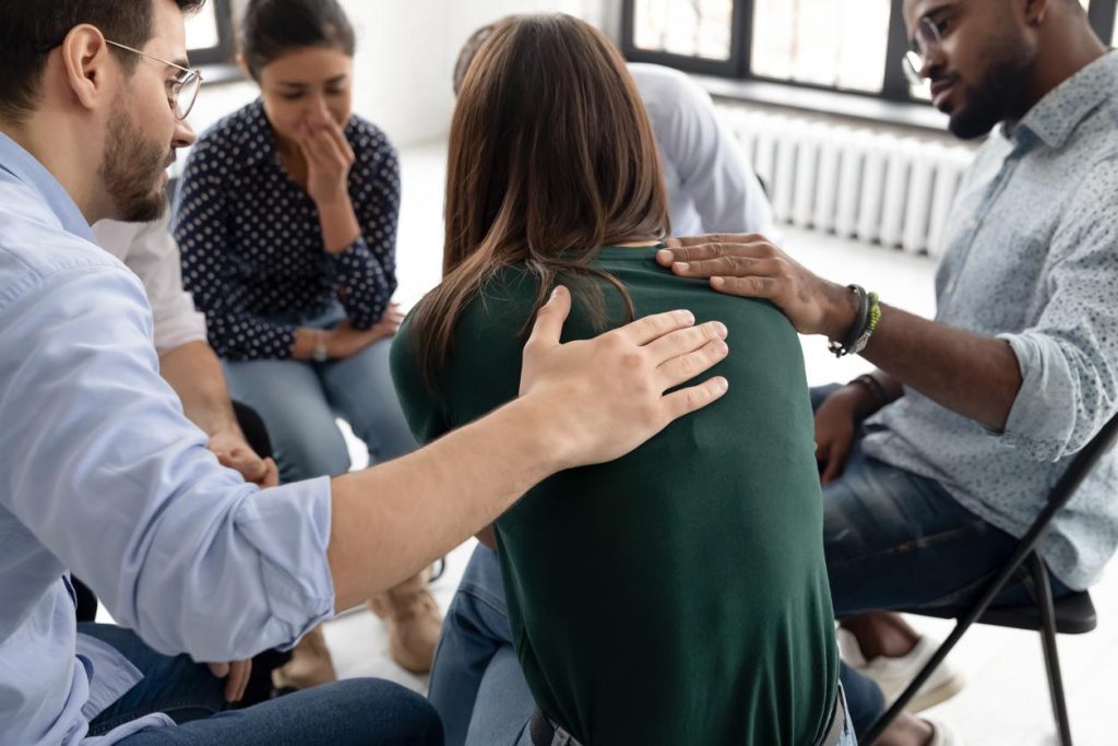 A Woman gets Support at a Group Intervention in Minneapolis, Minnesota